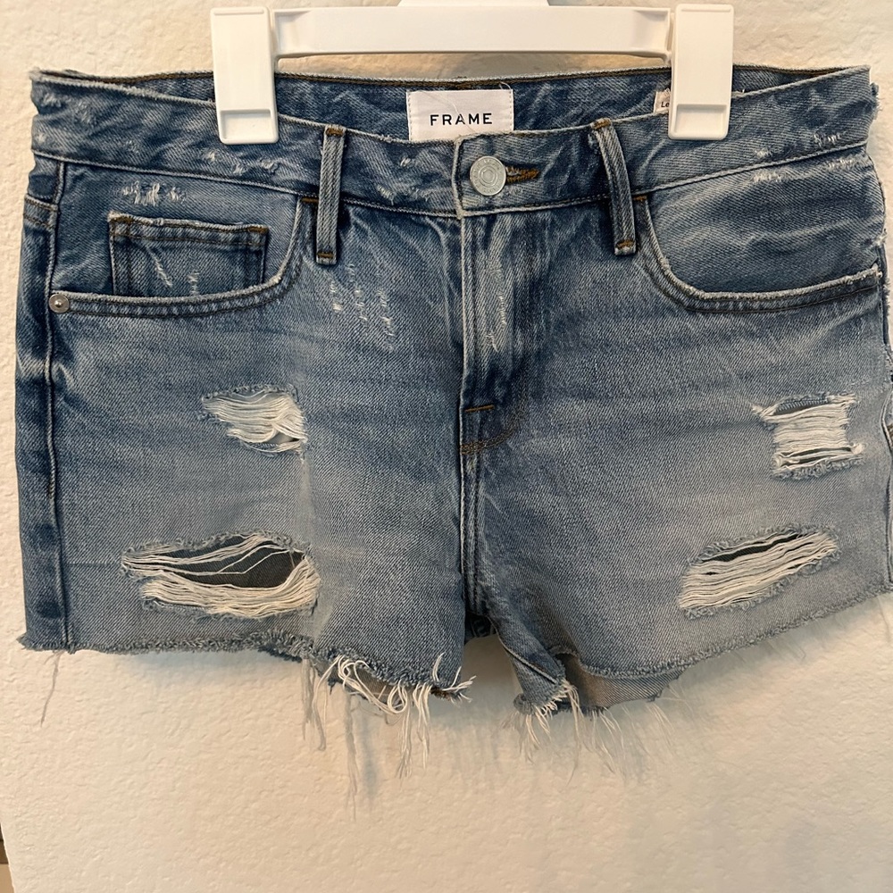 Frame Le grand garçon frayed denim shorts.